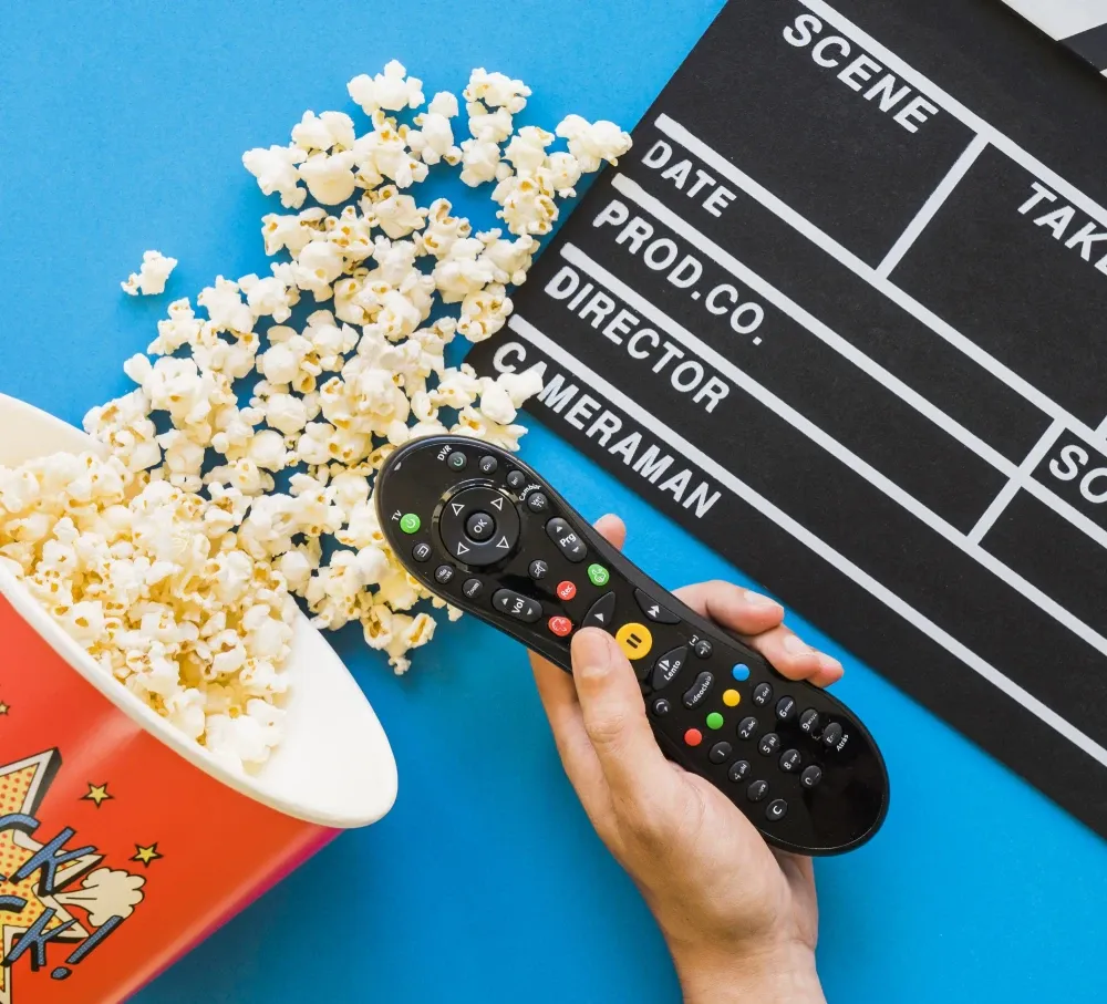 Custom home theater installation scene with popcorn, film clapperboard, and remote control for audio-video equipment and smart cinema automation
